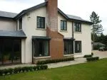 161 - Side elevation showing stormproof style windows in charcoal spray finish