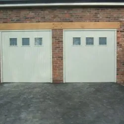 230 - Boarded Garage Door, fully automated with leaded hetched glass