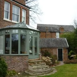 100 - Slate green conservatory with a Victorian roof