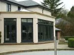 156 - French doors and bidfolding doors with upper glazed lights. This room also features a lantern light