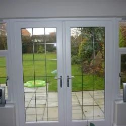 253 - Double doors with leaded glass and a white spray finish