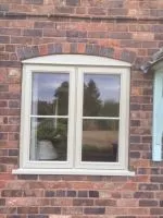 Stormproof window with bar design and arched insert