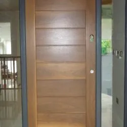 286 -Contemporary front door featuring horizontal panels and manufactured in walnut