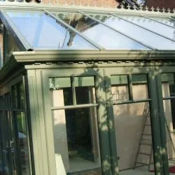 097 - Rectangular conservatory with a sun rise gable spray finished in slate green