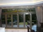 145 - Bifolding doors in a charcoal grey colour with glazed lights above the doors