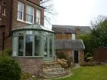100 - Slate green conservatory with a Victorian roof