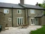 184 - Elevation view of bar style property - contrast spray finish used on the windows and the entrance door