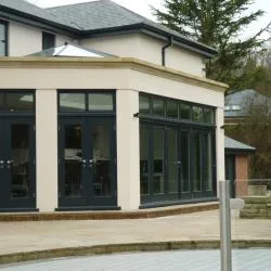 156 - French doors and bidfolding doors with upper glazed lights. This room also features a lantern light