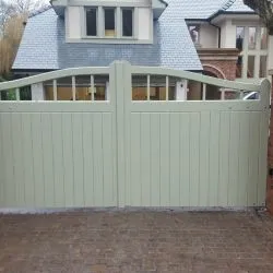 Fully automated gate - design of gate is curved top with boards and bars at the top