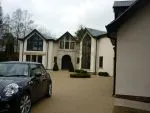 163 - Front elevation of property with feature apexes - spray finished in a charcoal colour