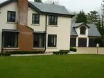 159 - Image showing triple garage doors to the right hand side of the photo and curved window