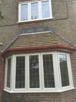 Stormproof style bay window and triple light window upstairs, complete with leaded glass