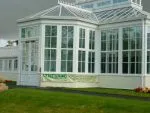 106 - French doors on the orangery consist of a panelled base and georgian styling on the glazed units