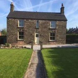 078 - Front elevation of cottage with sash windows