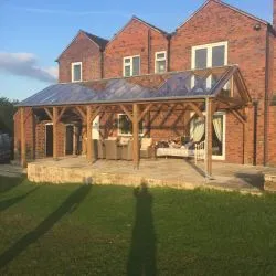 Pergola manufactured in hardwood complete with glazed roof