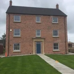 077 - Front elevation of property showing sash windows and entrance door