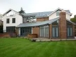 205 - Rear elevation of property showing French doors and bifolding doors in a contemporary grey tone